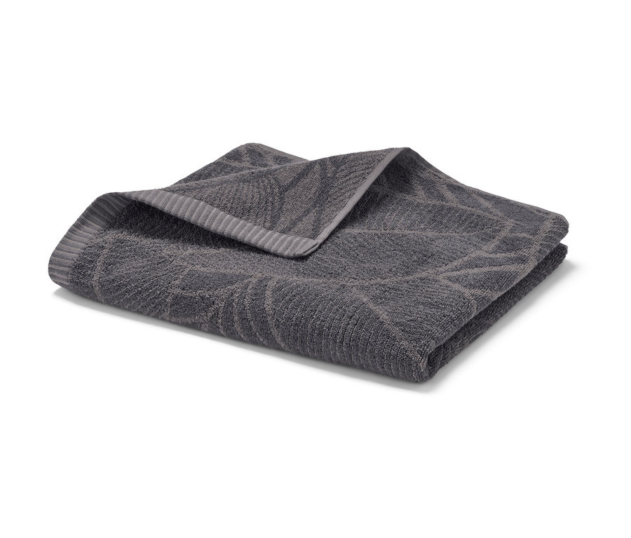 Katlanmış, antrasit rengi jakar banyo havlusu.